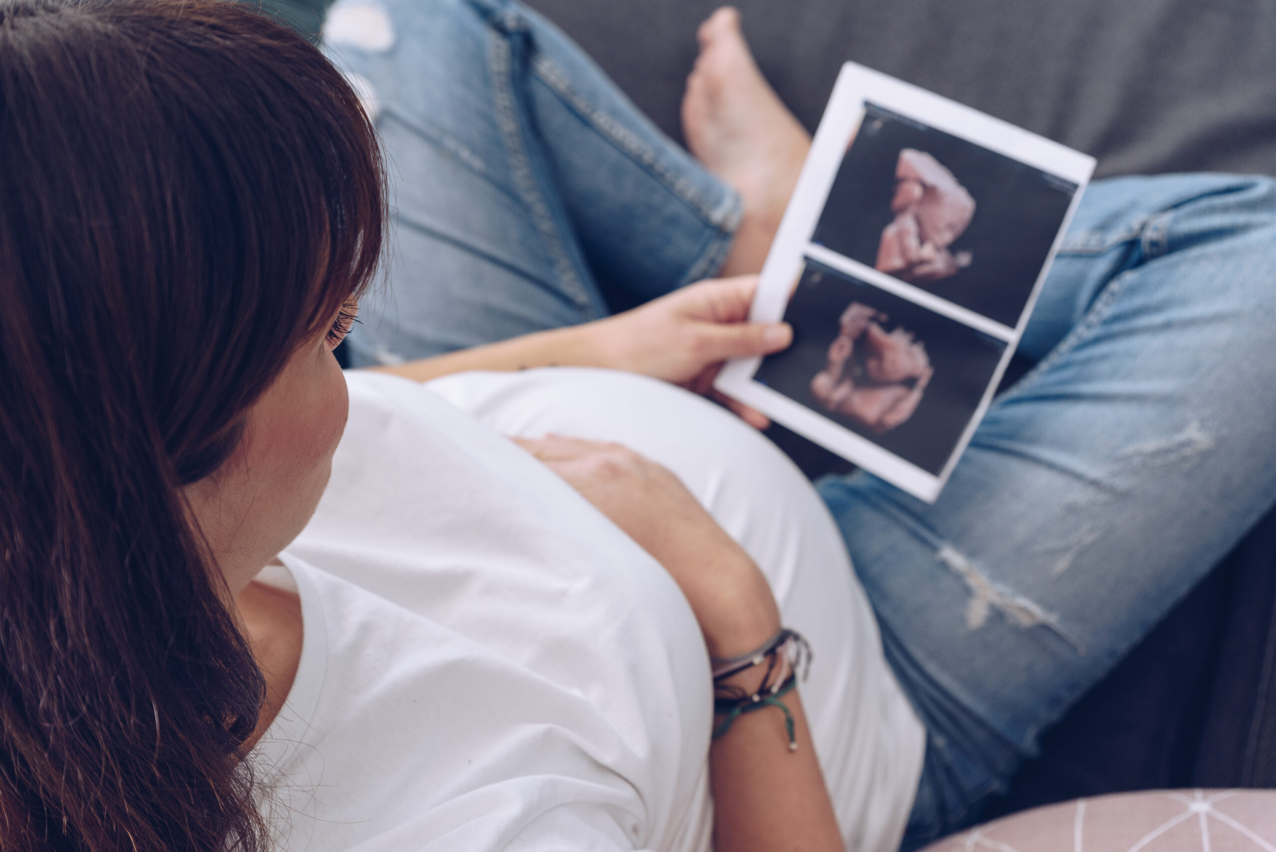 Pregnant woman with ultrasound image